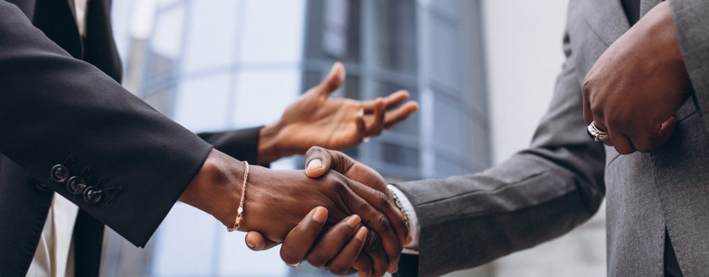 African business male people shaking hands